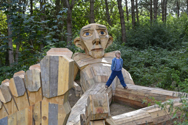 This Artist Creates Phenomenal Giant Sculptures From Recycled Wood In Completely Unexpected Places