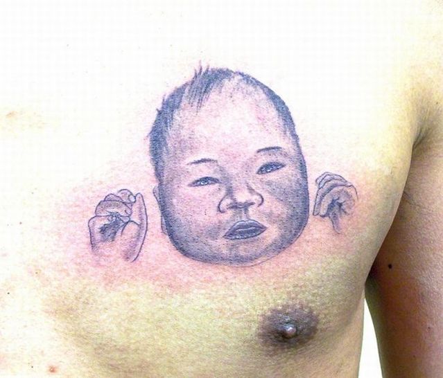 Series of the most WTF tattoos ;)  (60 photos)