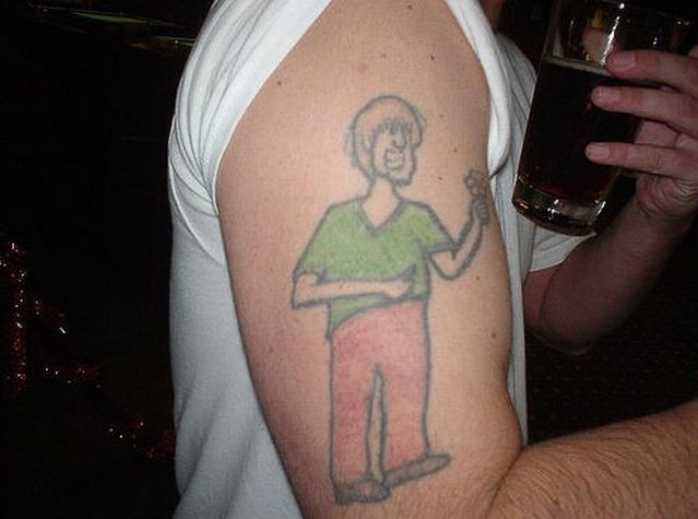 Series of the most WTF tattoos ;)  (60 photos)