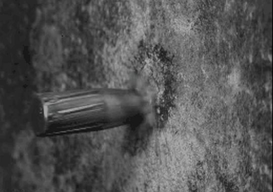 Bullet vs a wall (1 gif)