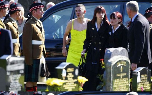 At a friend’s funeral in a woman's dress (5 pics)