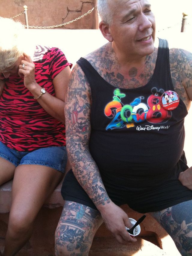 Man with Disneyland cartoons tattoos (15 pics)