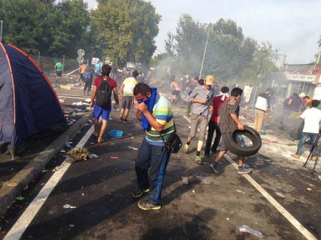Hungarian Police Fight Migrants with Tear Gas and Water Cannons